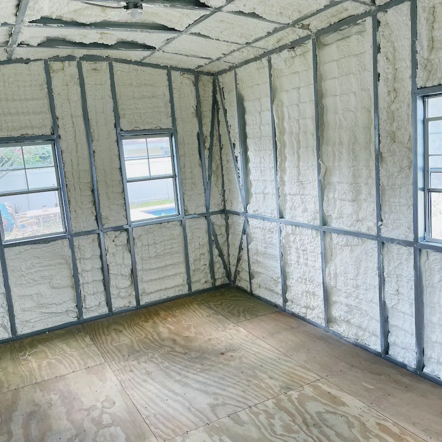 Closed-cell spray foam insulation applied to wall cavities in a residential project in Manlius